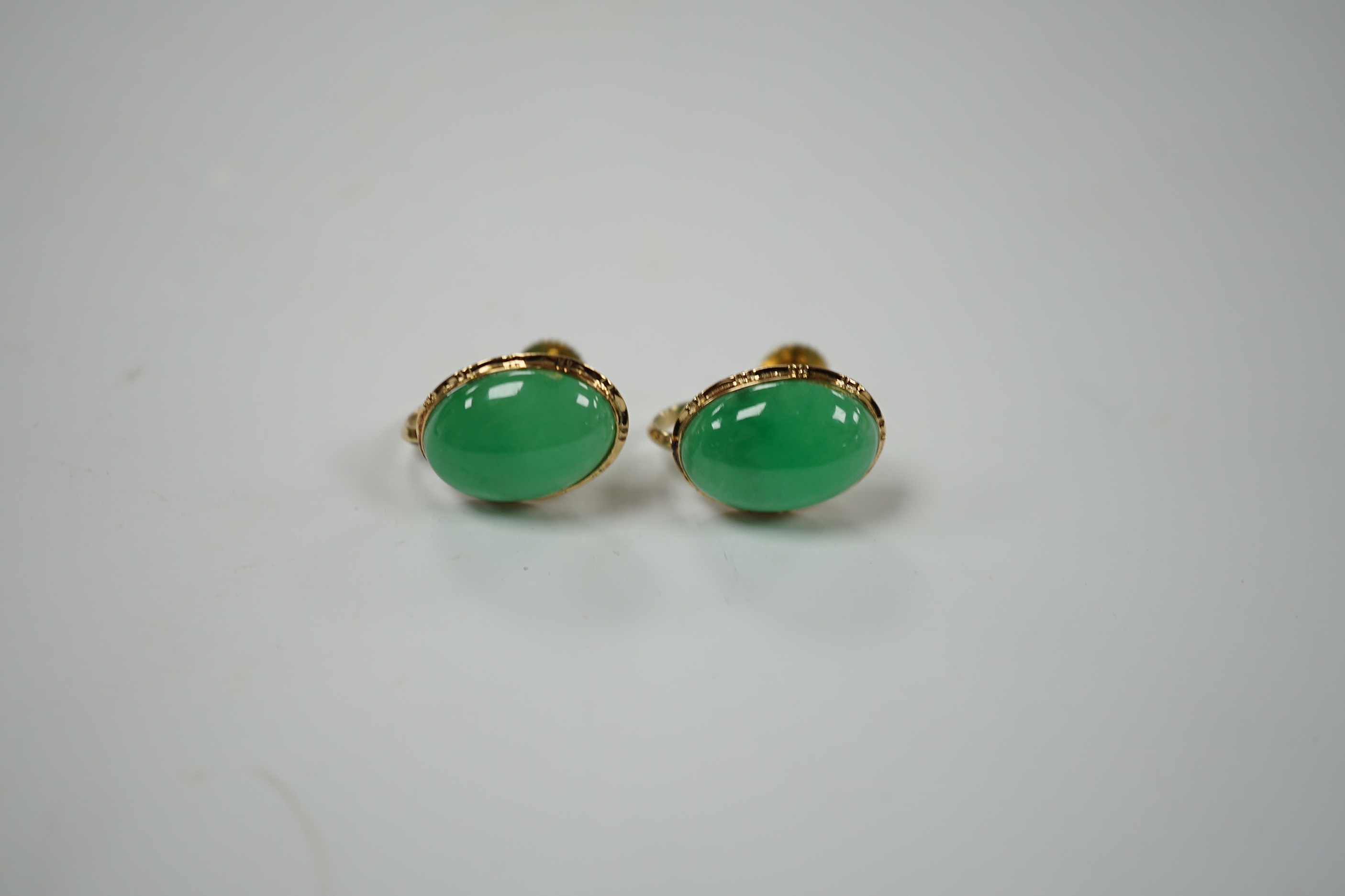 A pair of yellow metal mounted jade earrings, in associated Garrard box